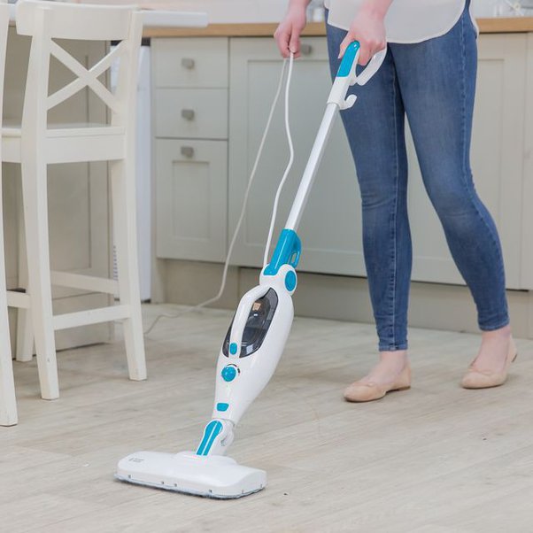 Step 2: Toss the mop and use a steamer or a spray-and-vac machine