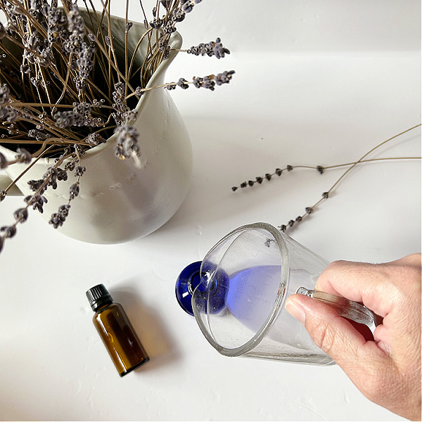 Pouring DIY linen spray into bottle